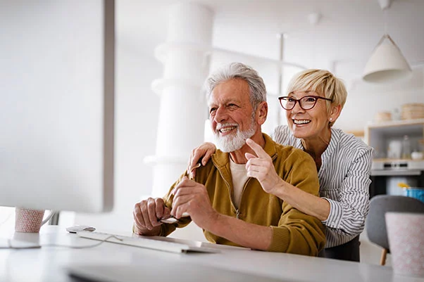 Couple using a computer together