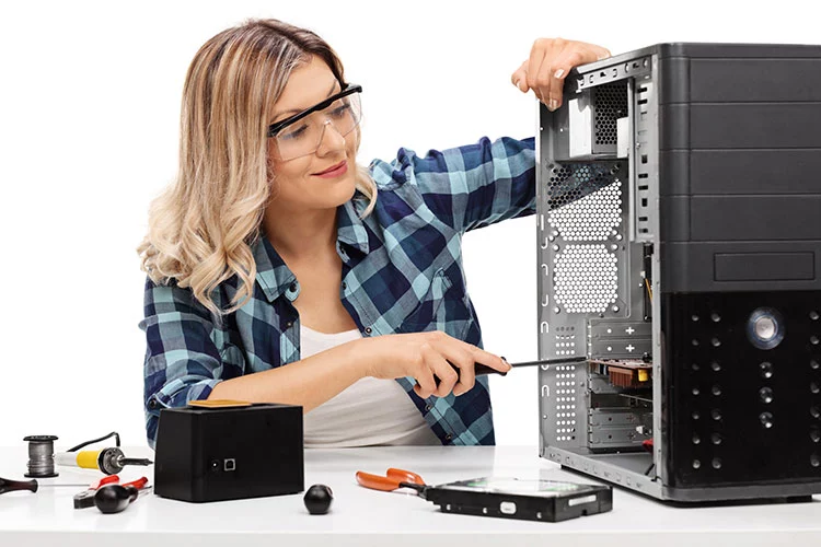 Technician repairing a desktop computer